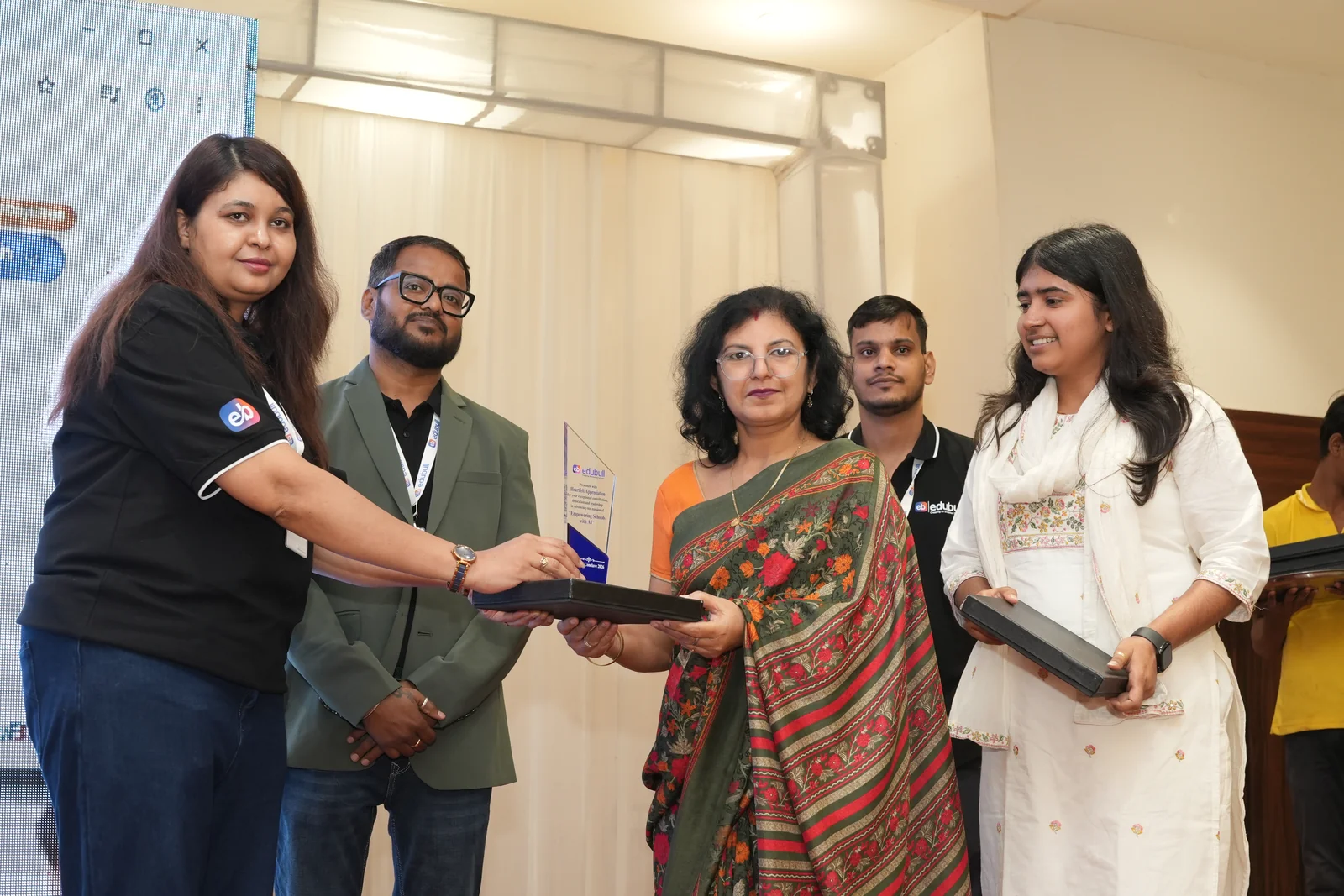 School representatives being honoured on stage
