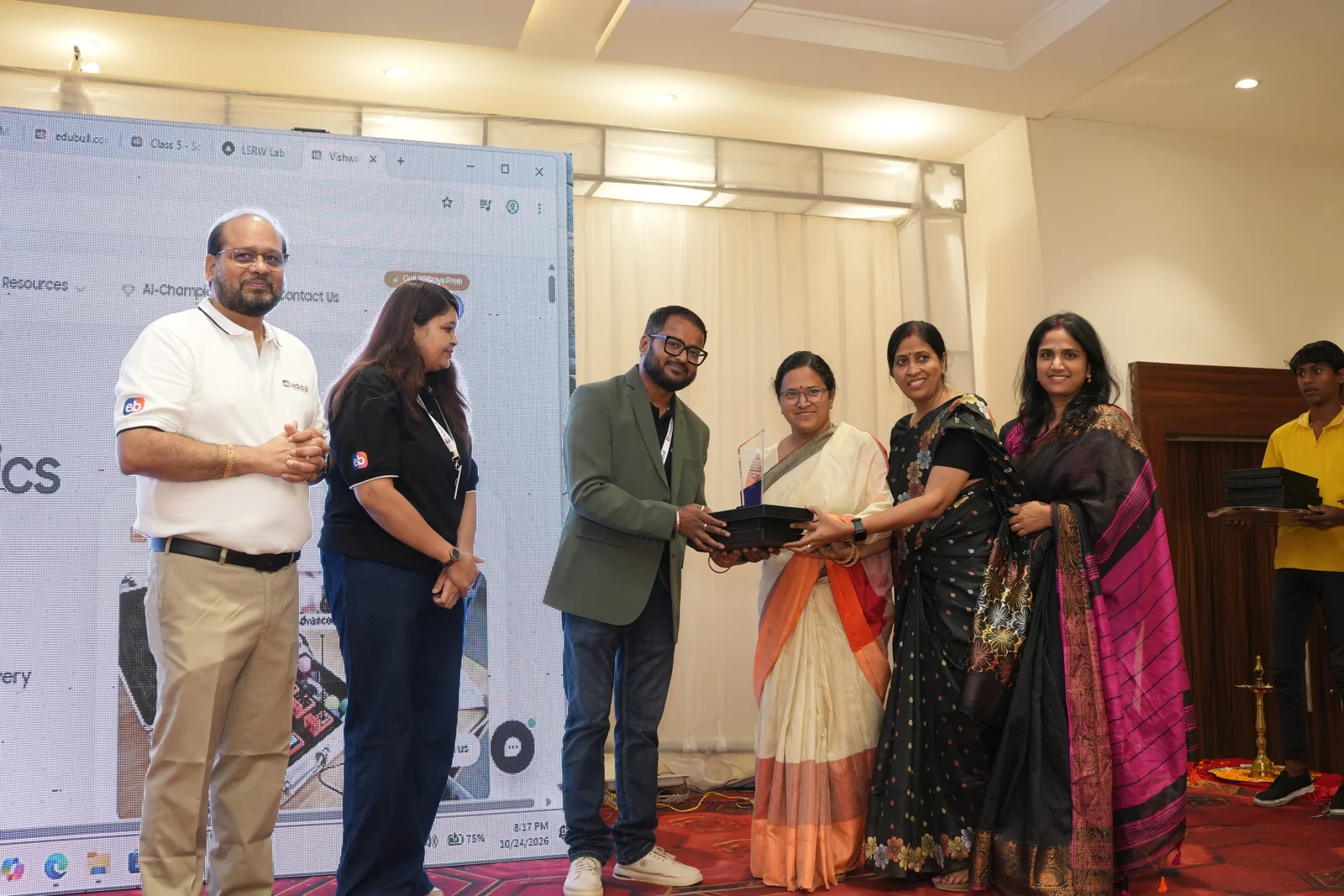 School team and principal receiving certificate of collaboration