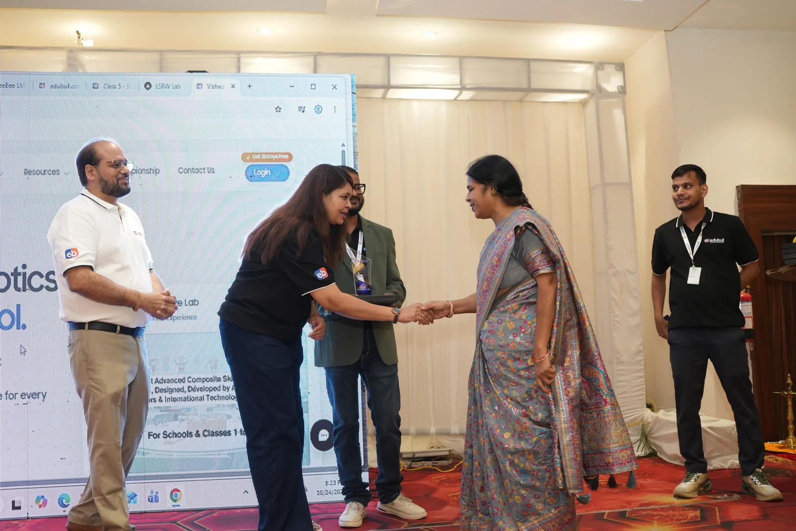 School leader receiving partnership honour on stage