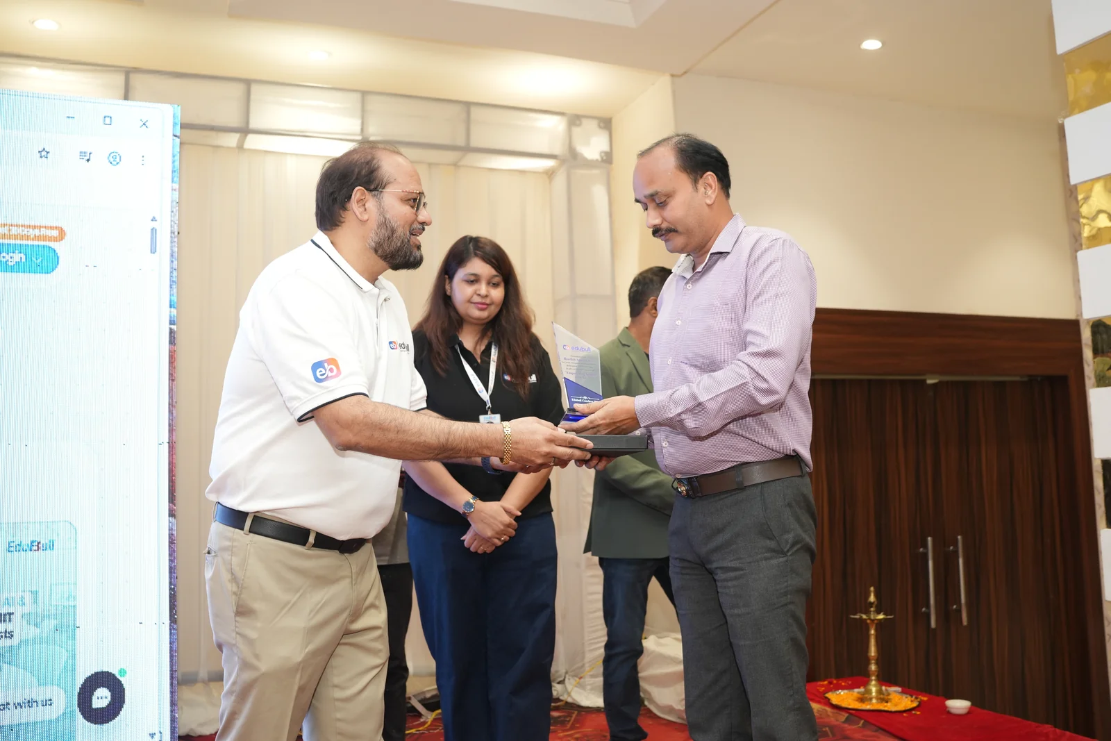Director receiving partner memento from Mr. Girish Sharma