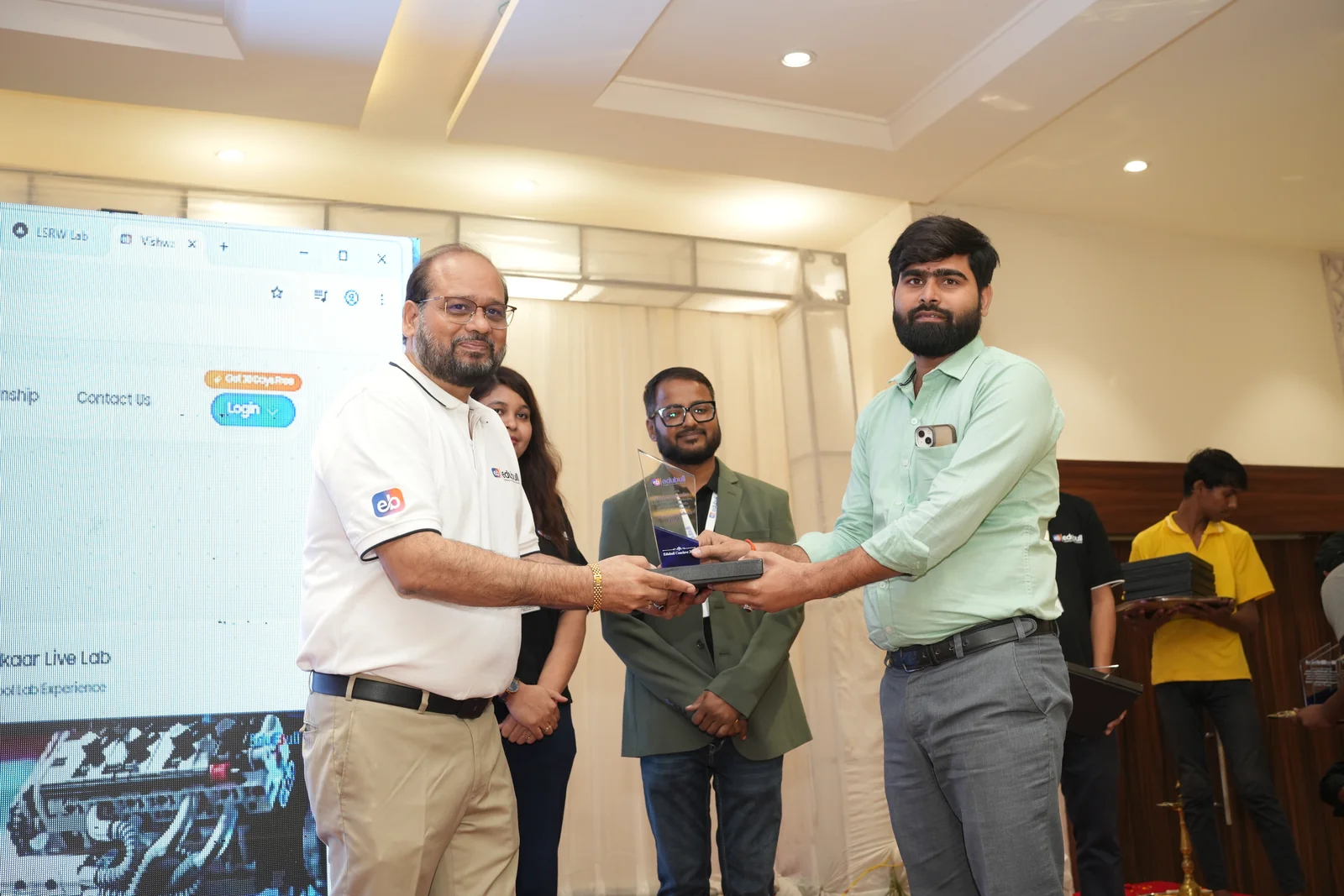 School director presented with leadership award by Mr. Girish Sharma on stage