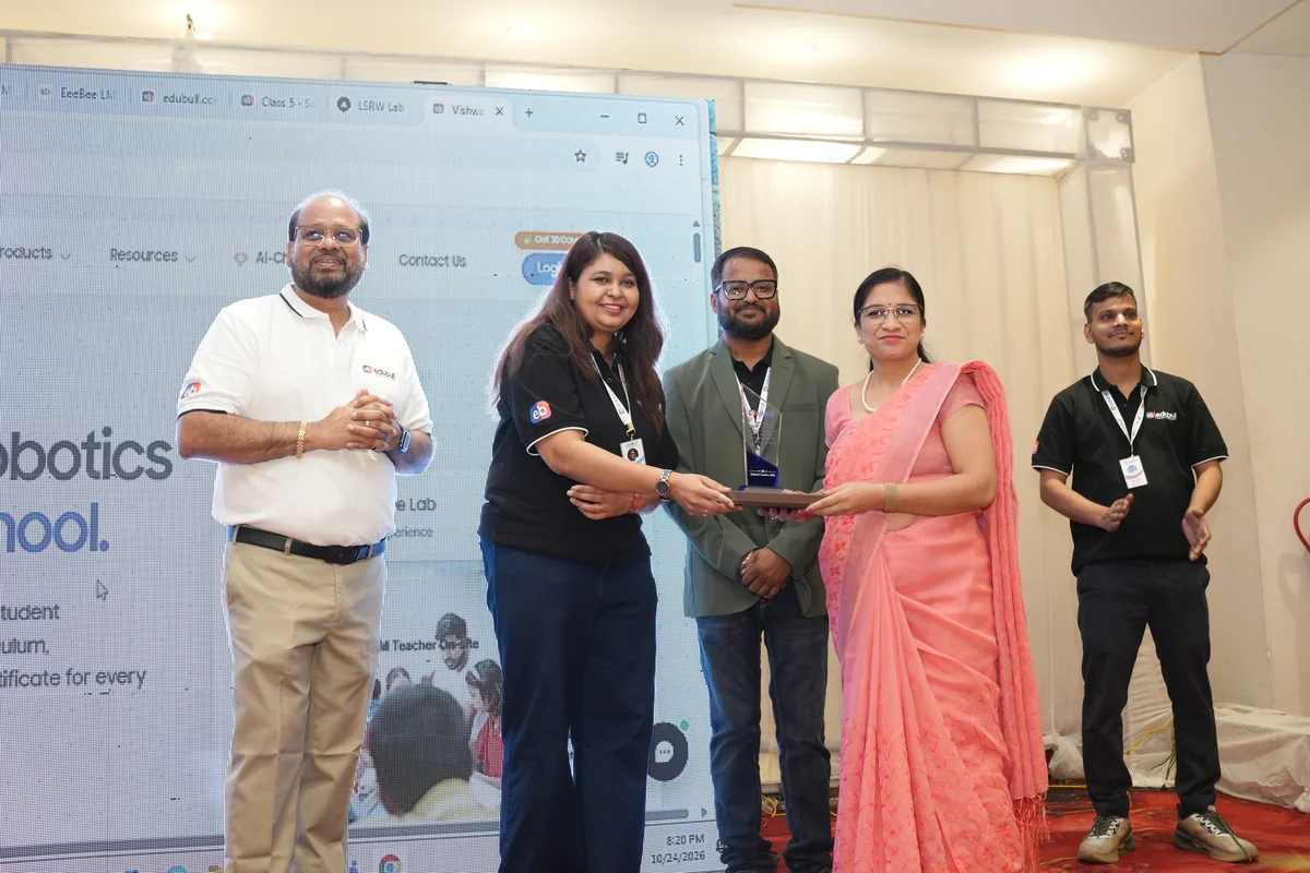 School principal being felicitated with memento for educational leadership and progressive pedagogy