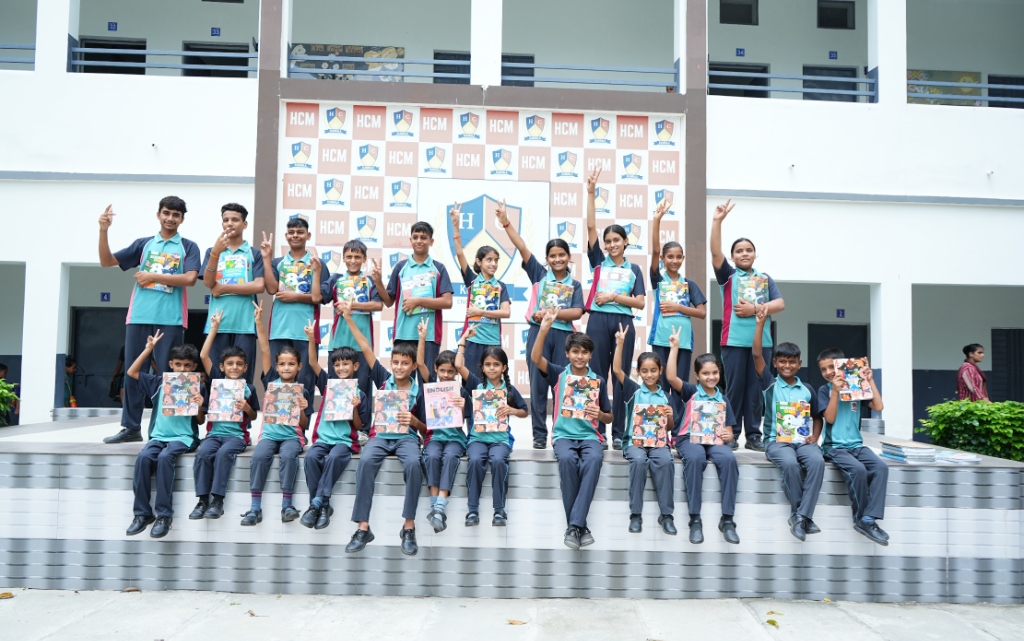 School students proudly holding Edubull Hybrid-Books in school courtyard